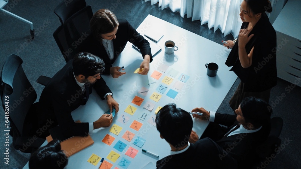Poster top view of smart executive manager discuss and choose marketing idea from sticky notes. group of bu