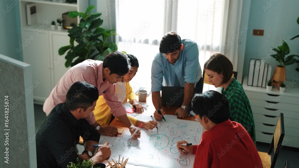 Aufkleber top view of happy creative team putting hands together while drawing mind map. group of diverse peop