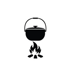 Black campfire pot cooking over flames heat