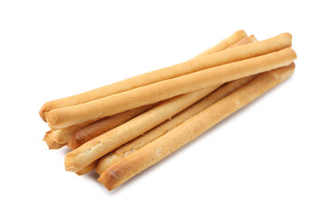 Many delicious grissini sticks isolated on white