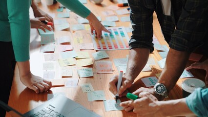 Top view of skilled designer explain and brainstorming idea for logo design and writing concept....