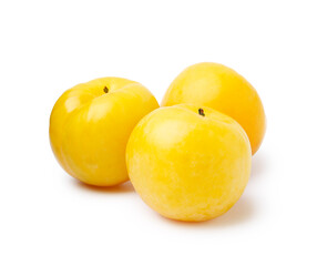 Whole ripe yellow cherry plums isolated on white