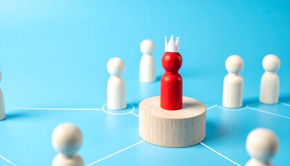 A red figurine stands on a wooden pedestal, wearing a crown, surrounded by several other figurines, symbolizing leadership and authority.