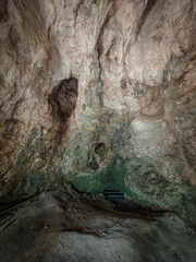 The inner chamber of Kő-lyuk Cave in the Bükk Mountains, Hungary, ending in a gated passage...