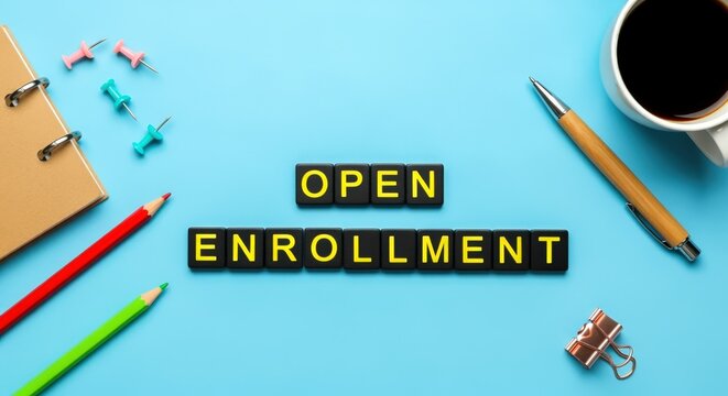 Open Enrollment Flat Lay Featuring Stationery and Coffee on a Blue Background