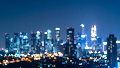 Fototapeta premium ぼやけたオフィスビル群の夜景 背景画像