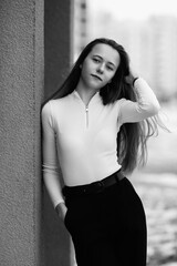 Portrait of a young beautiful long-haired girl outdoors in winter.