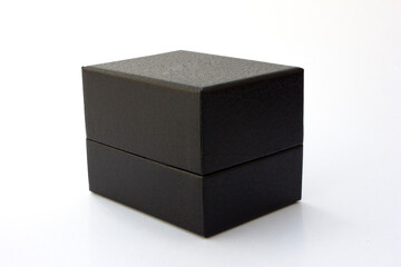 A closed black leather box packaging for luxury watch, isolated on white background.