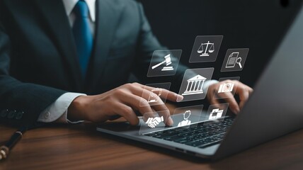 Lawyer uses laptop with legal icons for digital justice and online legal services research