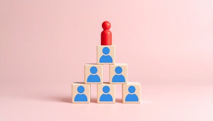 Leadership concept illustrated with a pyramid of wooden blocks, signifying hierarchy, and one figurine on top of a pyramid