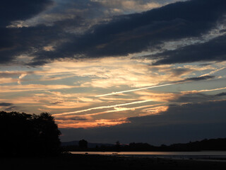 Vibrant colors of the morning sky. A colorful sunrise with the clouds illuminated by the rising sun. Middle Creek Wildlife Management Area, Lancaster County, Pennsylvania.