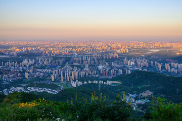Overlooking Beijing cityscape at sunset from Western Hills