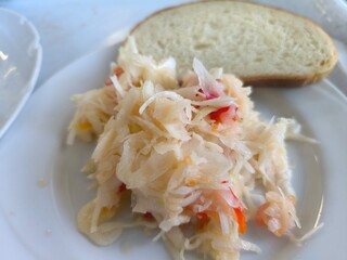 delicious sauerkraut salad lies on a white plate