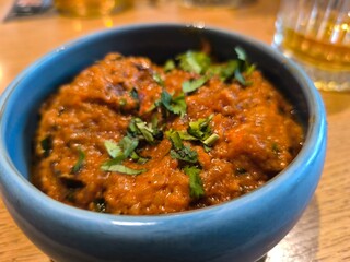 Baked fried potatoes with parsley in black plate