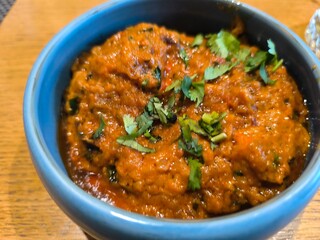 Baked fried potatoes with parsley in black plate