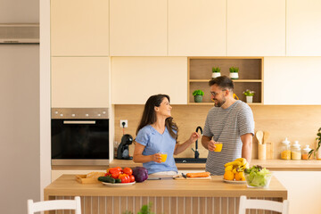 Joyful cooking experience in a bright modern kitchen with friends