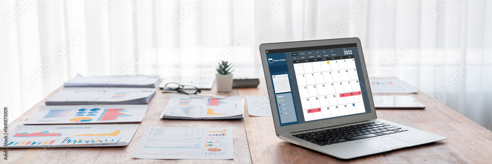 Poster calendar on computer software application for brisk schedule planning for personal organizer and onl