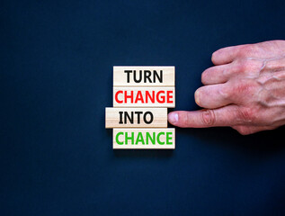 Turn change into chance symbol. Concept words phrase Turn change into chance on beautiful wooden...