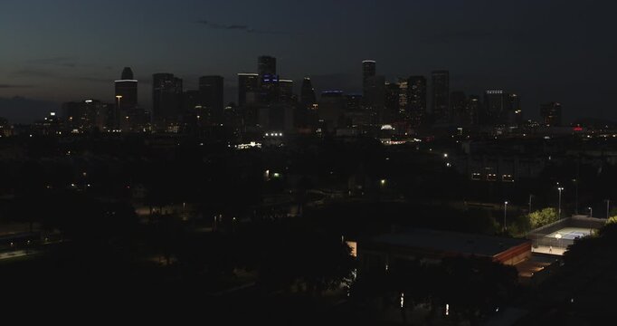 Drone view of downtown Houston, Texas and surrounding area at night