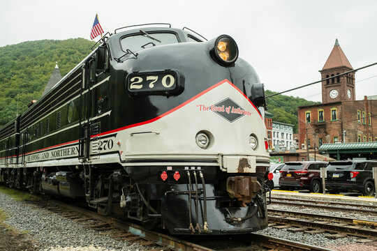 Jim Thorpe, PA , USA - August 31, 2024: Vintage train 270 parked beside the station, showcasing its classic design against a backdrop of green hills and historic buildings
