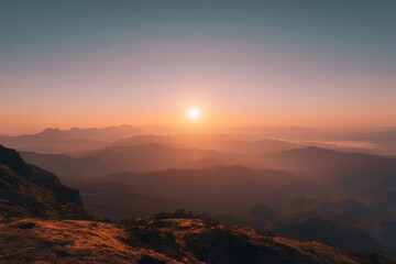 Obraz premium Majestic sunset over mountain ranges in a serene landscape during golden hour