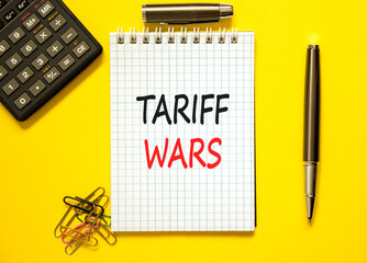 Trade tariff wars symbol. Concept word Tariff wars on beautiful white note. Black calculator. Black...