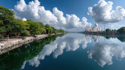An architectural masterpiece stands proudly with its stunning reflection in tranquil water, surrounded by lush greenery and vibrant colors