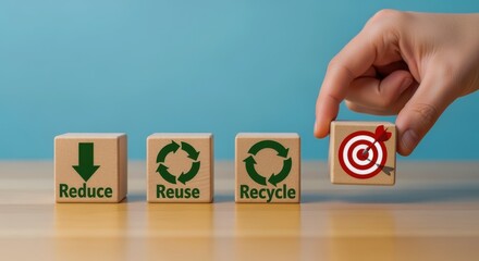 Reduce, Reuse, Recycle concept: Hand places wooden block completing the process, achieving sustainable goals