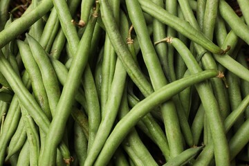 Fresh pea pods as background, top view
