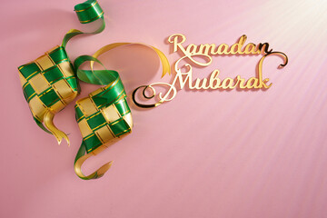 Ribbon ketupat and gold color calligraphy ramadan mubarak
