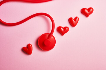 High angle view of red heart with stethoscope