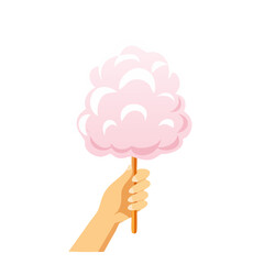 A hand holding a fluffy pink cotton candy