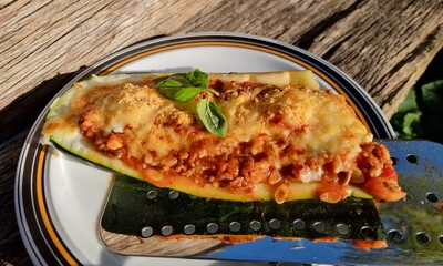courgette boats, filled with minced meat, gratinated with cheese