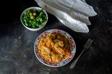 Shrimp pilaf and lettuce salad on a wooden table