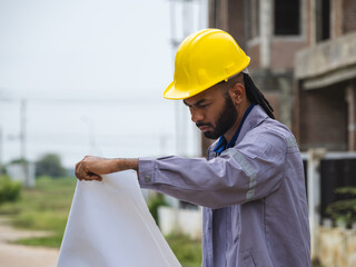 Professional architect and foreman wear head hat look meeting safety work teamuse check inspection...
