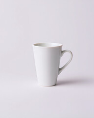 Obraz premium White Ceramic Coffee Mug on Light Background