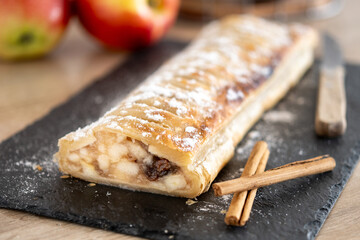Homemade apple strudel on wooden table