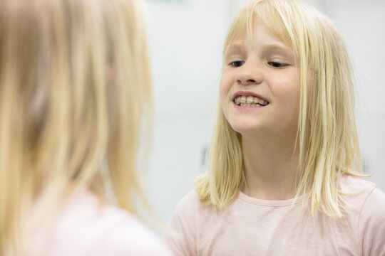 Blonde kid with dental plate