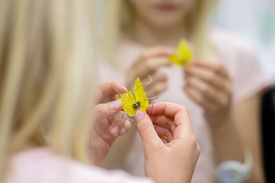Orthodontic plastic plate in child's hands