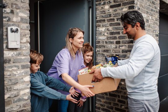 Amicable grocery delivery interaction at the door
