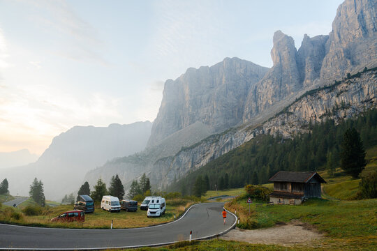 Camping vans parked in Dolomites at sunset 