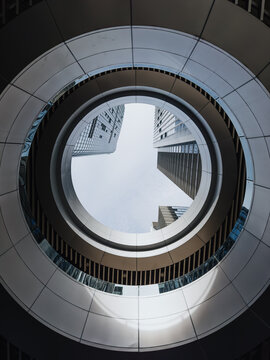 Circular Building Opening with Skyscrapers