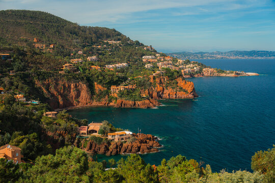 Sunlit  rocky coast of French Riviera in summer 