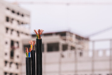 Electric cable with copper wire. Power cord construction site. Electrical wiring concept for...