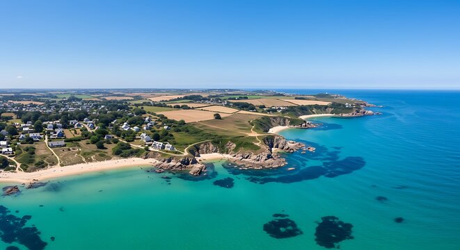 Scenic an aerial view of perharidy peninsula from drone, with lush tropical palms, on a sunny day with blue sky in france, bretagne, roscoff