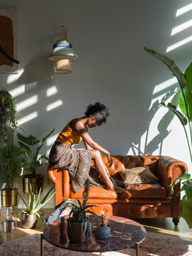 Woman procrastinating at home