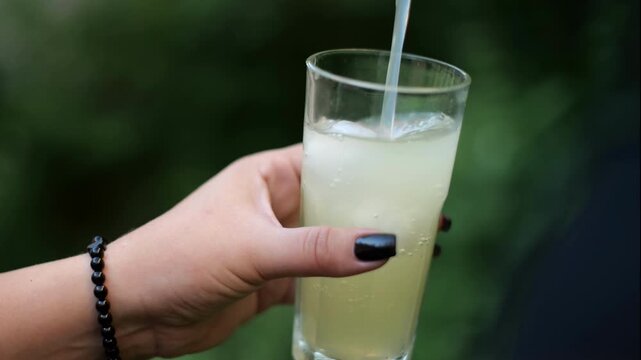 lemonade being poured into a glass