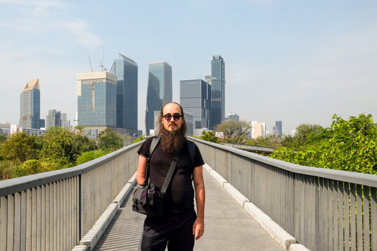 Man on Urban Skywalk in Bangkok