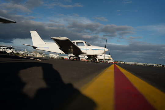 Low Angle View of Light Aircraft Parked on Tarmac