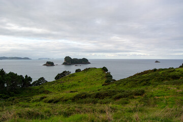 Serene Coastal Landscape with Islands and Green Hills